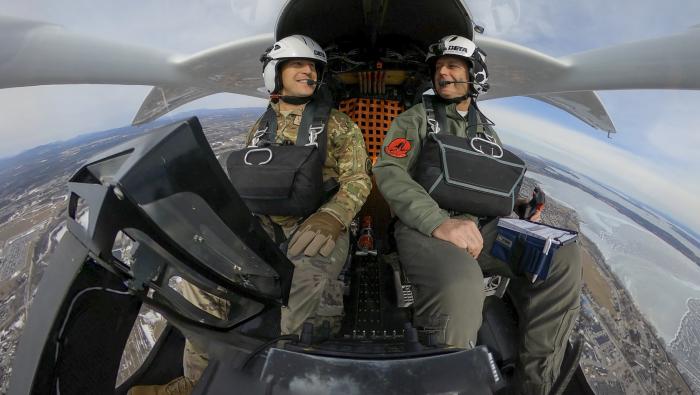 A Beta test pilot and U.S. Air Force pilot are pictured in a Beta Alia 250 eVTOL aircraft.