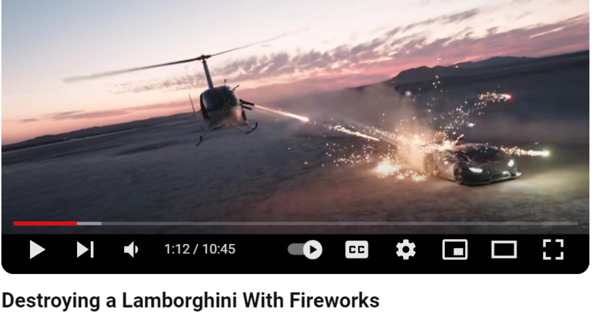 Helicopter shooting fireworks at car