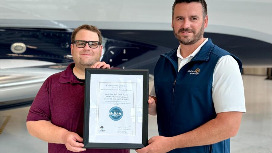 Sonoma Aviation’s safety manager Josh Foster and Clayton Lackey, v-p, present their IS-BAH Stage 3 certification.