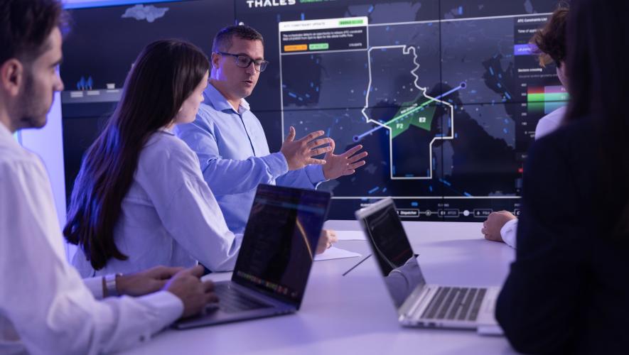 A Thales site in France. Employees are discussing eco-friendly ATM trajectories  